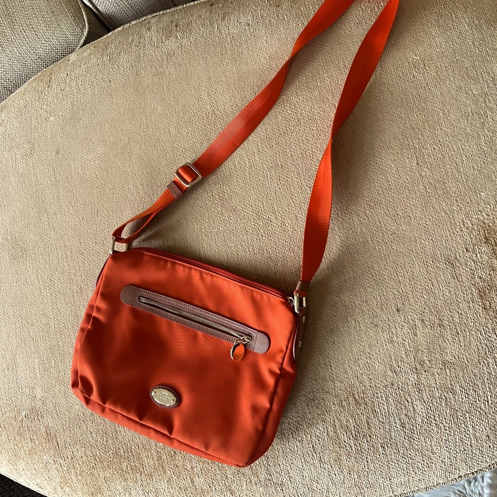 Orange cross body coach bag